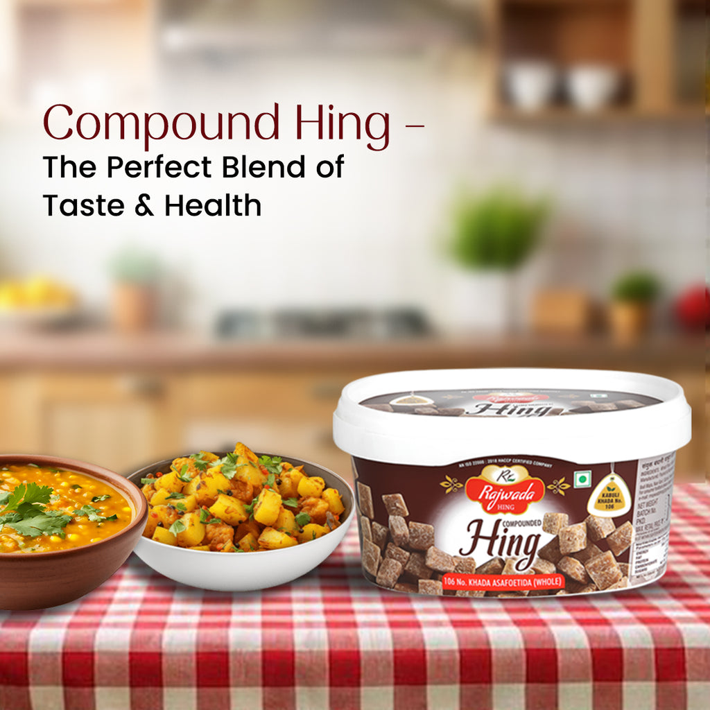 Container of Rajwada Hing with two bowls of food on a checkered tablecloth in a kitchen setting.