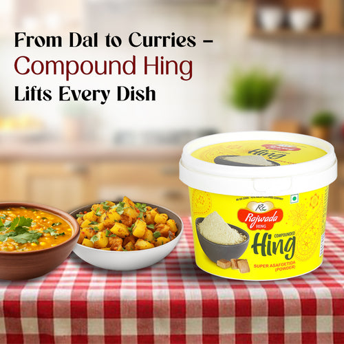 Bottle of Rajwada Hing on a table with two bowls of food, text 'From Dal to Curries - Compound Hing Lifts Every Dish'.