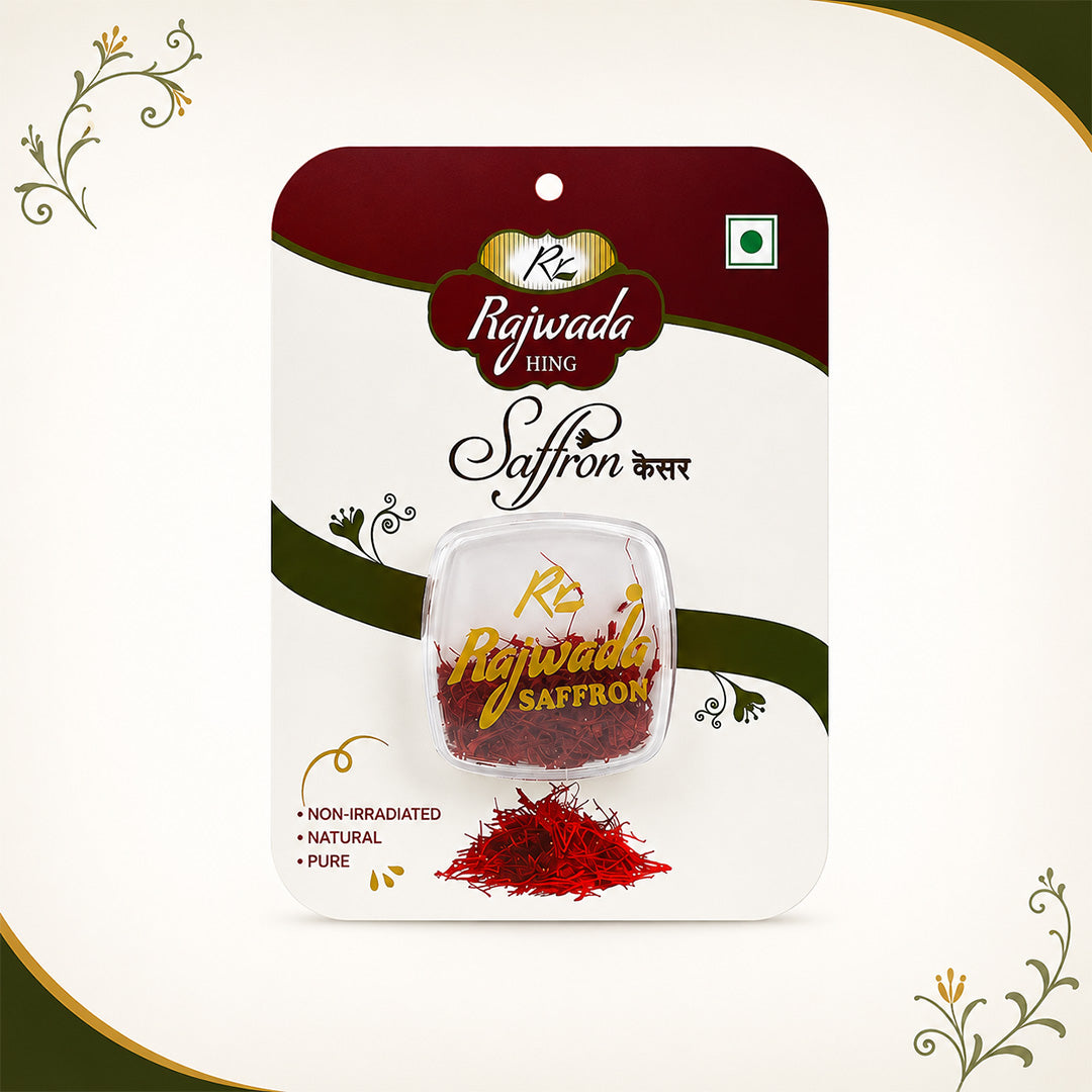 Rajwada Saffron Kesar in its retail blister packaging, featuring a clear window showing the red saffron threads inside. The packaging is white with dark red and green accents, and includes decorative gold and black text.