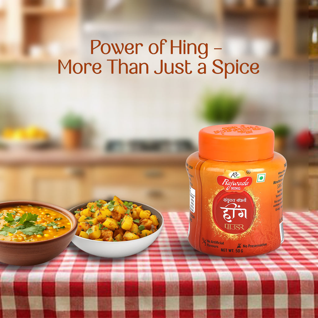 Jar of Sanyukt Bandhani Hing Platinum Powder with two bowls of food on a checkered tablecloth in a kitchen setting.