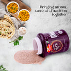Sanyukt Bandhani Hing Powder – Premium Quality for Perfect Tadka container with a spread of spices on a table with food items